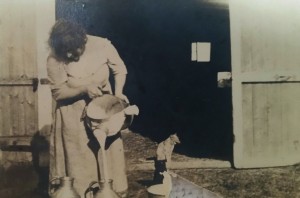 Nora Moore pouring milk into cans. Undated. Photo courtesy of Noreen Heath-Paniagua